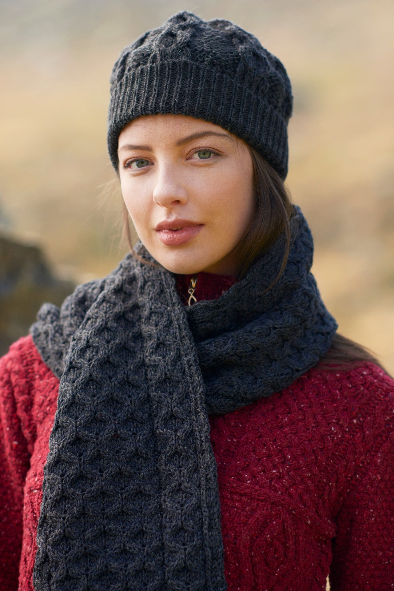 Elevate Your Winter Style with Aran Cable Knit Pom Pom Scarf